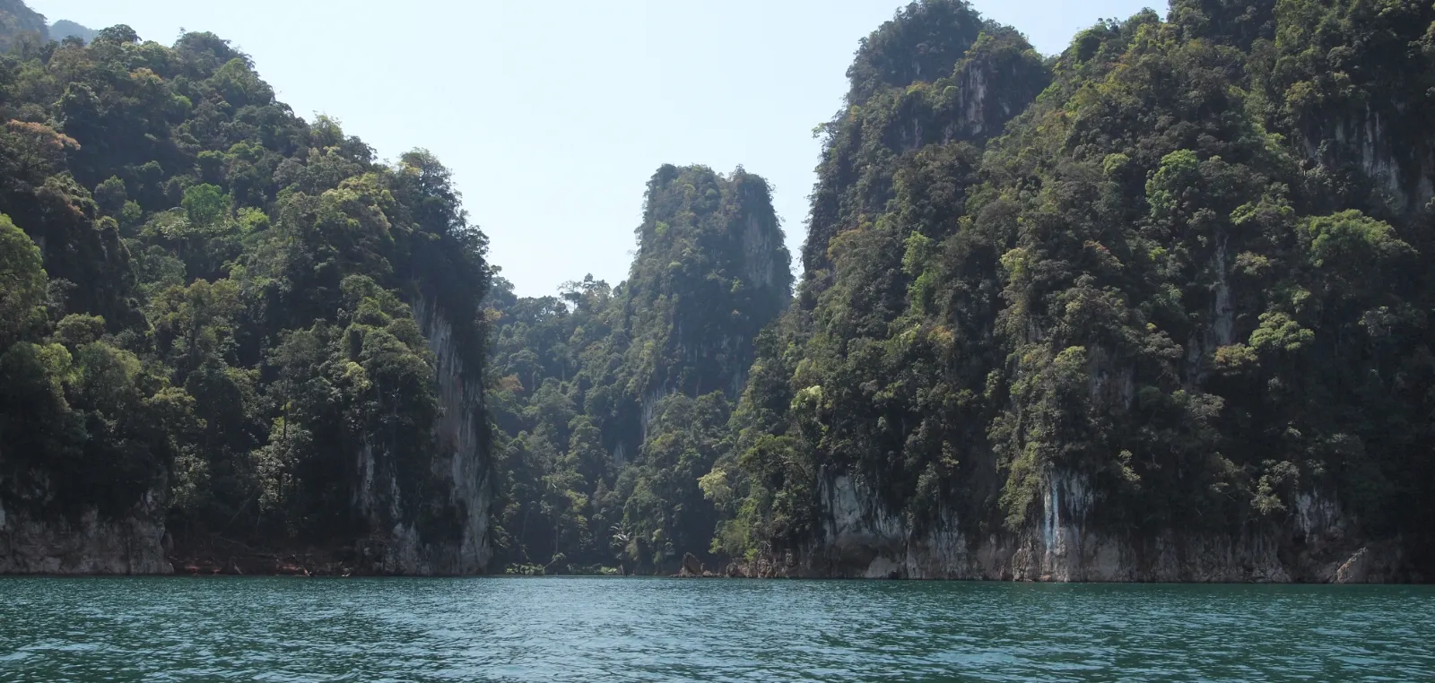 Limestone karst rising over rainforest at Khao Sok