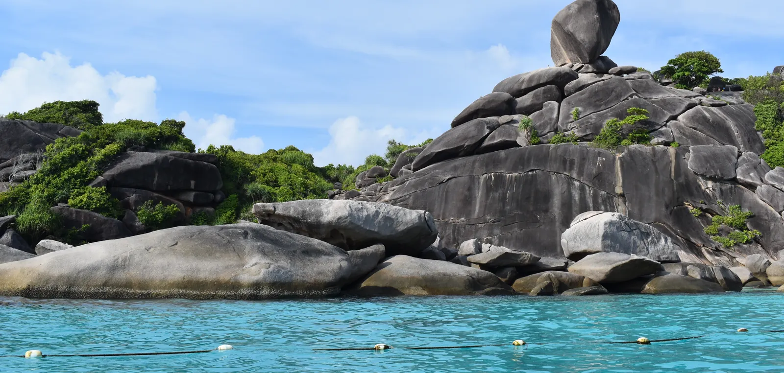 Granite boulders above turquoise water at Donald Duck Bay in the Similan Islands